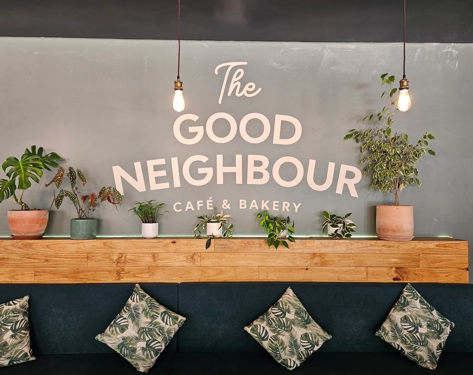 Good Neighbour brand wall with neon sign