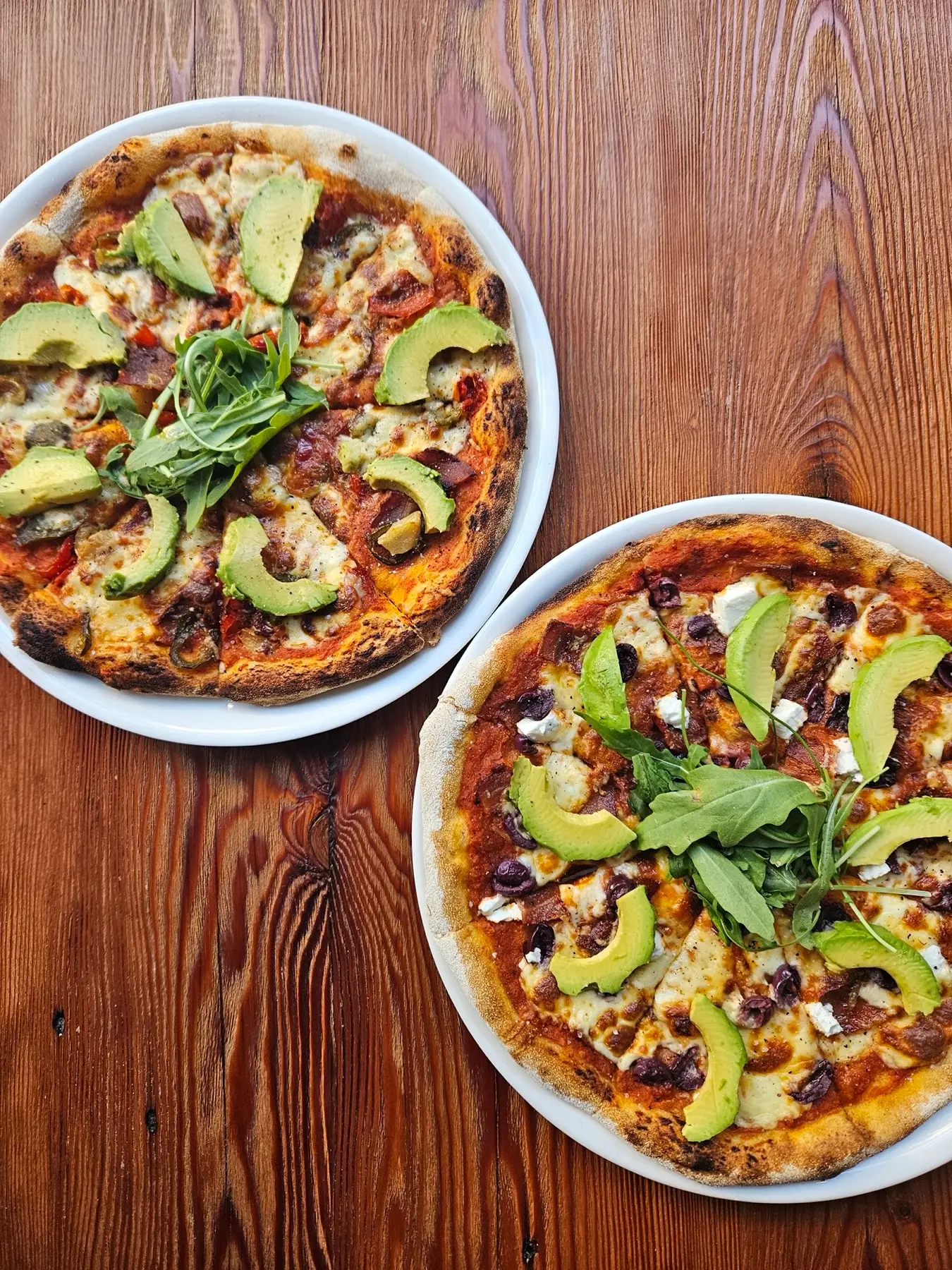Sourdough pizza with avocado and rocket